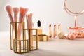 Set of makeup products and brushes on table Royalty Free Stock Photo