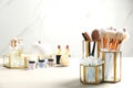 Set of makeup products and brushes on table Royalty Free Stock Photo