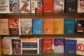 A set of Malayalam novels displayed in a book store. A shelf full of old and new Malayalam books - Kochi, Kerala: 18 February 2020