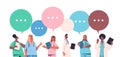 Set male female doctors in uniform with chat bubbles communication healthcare medicine concept Royalty Free Stock Photo