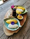 Set of mango and sticky rice with mango pudding, juice on wood table