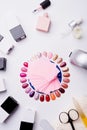 Set for manicure with gell polish bottles, LED lamp and accessoires on white background. flat lay