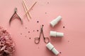 set of manicure tools and accessories on a pink background with flowers and rhinestones. Nail care. Top view, flat lay Royalty Free Stock Photo