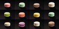 Set of many macaroni multicolored. Delicious macaroons isolated on black background. French sweet cookie