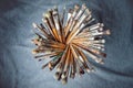 A set of many used paintbrushes in a circle
