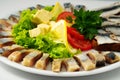 The set marinated mackerel,erring, herring fillet, sprat at Borodino bread, on the plate