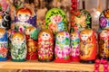 A set of Matryoshka dolls, lots of Russian stacking dolls on display, group of objects closeup, nobody, no people. Traditional