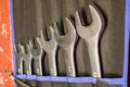 A set of metal open-end wrenches in the workshop Royalty Free Stock Photo