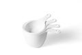 Set of measuring cups lined up, top view, white background Royalty Free Stock Photo