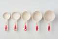 Set of Measuring Cups Lined on White Background Top View Royalty Free Stock Photo