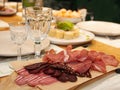 Set of meat cold cuts on wooden table Royalty Free Stock Photo