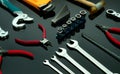 Set of mechanic tools on dark background. Chrome wrenches or spanners, hexagon socket, end cutter pliers, locking pliers, pincers