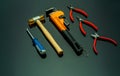 Set of mechanic tools isolated on black background. Screwdriver, red end cutter pliers, locking pliers, pincers, plastic hammer Royalty Free Stock Photo