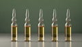 Set of medical ampoules in a line, against gradient background