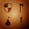 Set Medieval sword, Shield, Bomb ready to explode and Medieval axe on wooden background. Vector