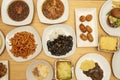 Set of Mediterranean food dishes with pasta with chorizo, white bean stew, meat lasagna, beef meatloaf, Russian salad, jamon