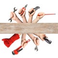 Set of men holding different construction tools and wooden surface on white background Royalty Free Stock Photo