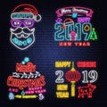 Set of Merry Christmas and 2019 Happy New Year neon sign with angels, santa claus in sleigh with deer and christmas Royalty Free Stock Photo