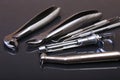 Set of metal medical equipment tools for teeth dental care on black mirror background. Selective focus. Royalty Free Stock Photo