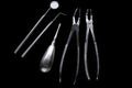 Set of metal medical equipment tools for teeth dental care isolated on black Royalty Free Stock Photo