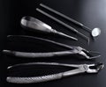 Set of metal medical equipment tools for teeth dental care isolated on black Royalty Free Stock Photo