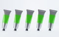 Set metal tubes with paints or hand cream. Aluminium packaging with blank green label and black cap. Cosmetic product