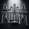 A set of metallic hand tools arranged symmetrically on a dark surface. Central focus Royalty Free Stock Photo