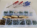 Set of metis and dowels in the organizer and colored screwdrivers