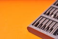 A set of miniature bits for the screw driver on orange background Royalty Free Stock Photo
