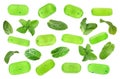 Set of mint hard candies and green leaves on white background