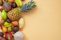 A set of mix tropical fruits on a beige background. With space for design. Exotic healthy eating. Seasonal organic raw Royalty Free Stock Photo