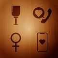 Set Mobile phone with heart, Wine glass, Female gender symbol and Telephone with heart speech bubble on wooden