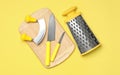 Set of modern cooking utensils on yellow background, flat lay