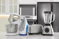 Set of modern home appliances on marble table in kitchen Royalty Free Stock Photo