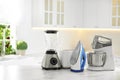 Set of modern home appliances on marble table in kitchen Royalty Free Stock Photo