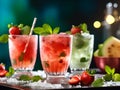 Set of mojitos. Strawberry mojito and traditional mojito assortment. Mocktail or coctail with strawberries and mint leafs.