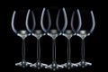 Set of mpty glasses for red wine in a row isolated on black background.