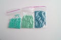 Set of multi-colored beads and beads in a mini plastic bag for embroidery needlework