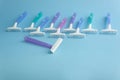 Set of multi-colored disposable razors on a blue background Royalty Free Stock Photo