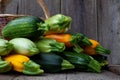 A set of multi-colored zucchini yellow, green, white, orange on the table close-up. Food background. Fresh harvested courgette, Royalty Free Stock Photo