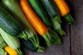 A set of multi-colored zucchini yellow, green, white, orange on the table close-up. Food background. Fresh harvested courgette, Royalty Free Stock Photo