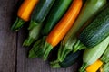 A set of multi-colored zucchini yellow, green, white, orange on the table close-up. Food background. Fresh harvested Royalty Free Stock Photo