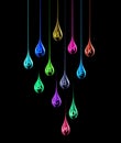 Set of multi vitamin complex in the shape of colored stretched drops on a black background