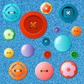 Set of multicolored buttons on a jeans background. Royalty Free Stock Photo