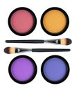 Set of 4 multicolored eye shadows and brush isolated on white Royalty Free Stock Photo