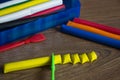 Set of multicolored plasticine bars for modeling on wooden table. Top view, eduction and creativity concept