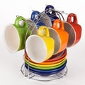 Set of multicolored teacups and saucers on stand Royalty Free Stock Photo