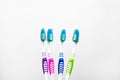 Set of multicolor toothbrushes for a family of four isolated on a white background. Oral hygiene brushing tooth concept