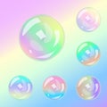 Set of multicolored transparent glass spheres on a plaid background Royalty Free Stock Photo