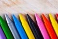 Set of multicolored wax crayons on wooden surface Royalty Free Stock Photo